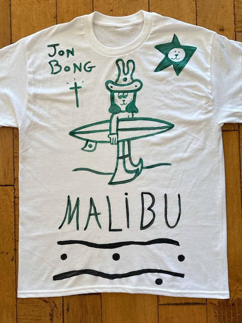 White Malibu Graphic Tee with Green & Black Artwork